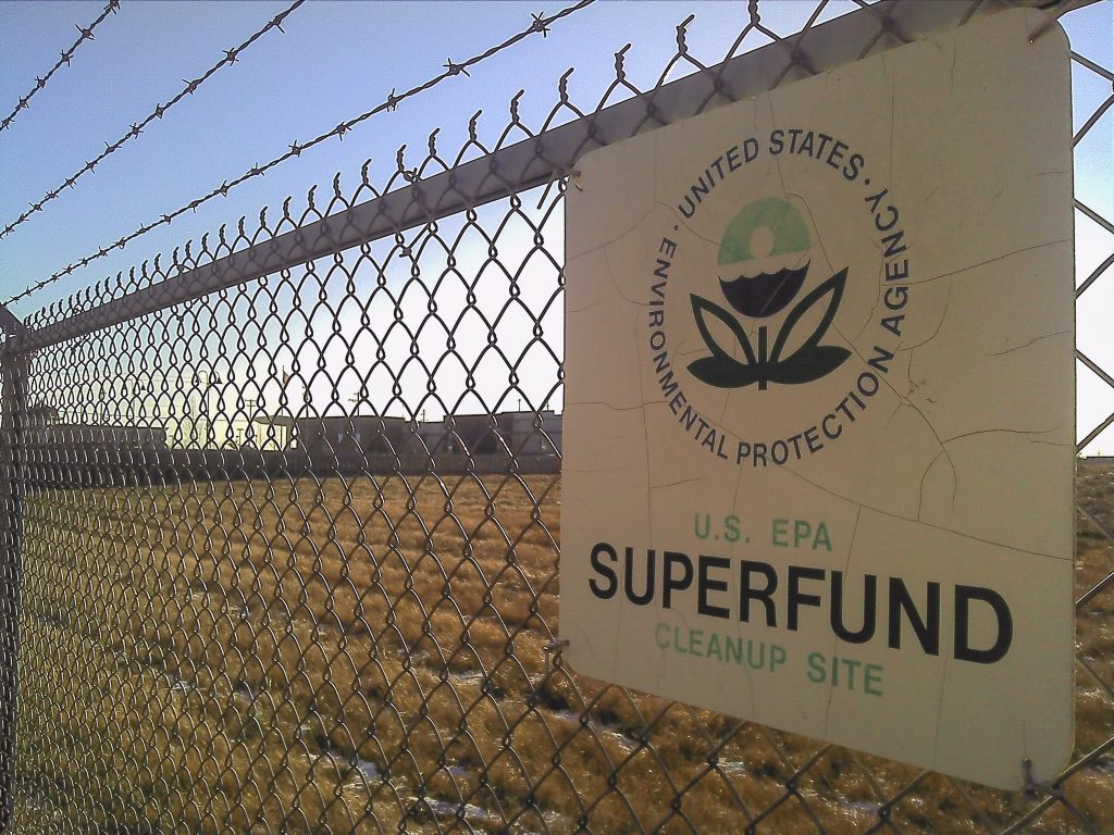 A EPA Superfund cleanup site sign on a chainlink fence