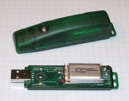 An accelerometer with its back unscrewed to show its inner mechanisms.