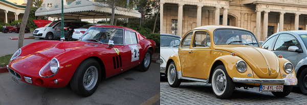 A red Ferrarri car on the left side of the image, and a yellow Volkswagen Beetle on the right side.