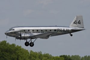 The DC-2 is similar to the previously shown Boeing 247, in terms of engine placement and large wing area. However, the DC-2 has 7 passenger windows with rounded corners, along with a less rounded vertical tail section, two thirds of which are part of the deflectable rudder. This aircraft is shown in the process of landing at an airfield.