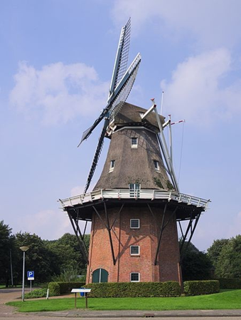 Old Dutch windmill with 3 story brick base